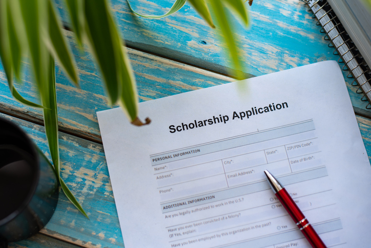 Illustrative form showing application for scholarship concept with pen