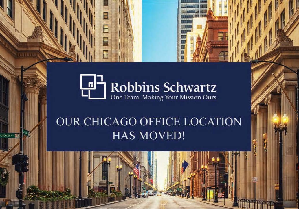 Robbins Schwartz law firm announcement overlay on Chicago downtown street reading "Our Chicago Office Location Has Moved!